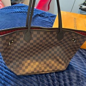 Gently used Louis Vuitton Neverfull MM tote bag
